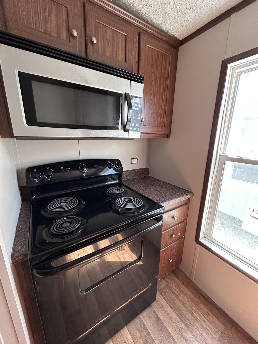 5 Bedroom with Common Area — kitchen stove and microwave